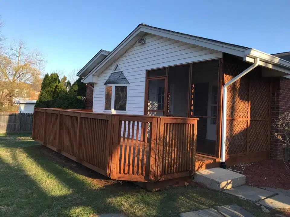 Beautifully restored wooden deck enhancing outdoor space, showcasing quality craftsmanship and attention to detail by Valentine Property Services, with a well-maintained home exterior in the background.